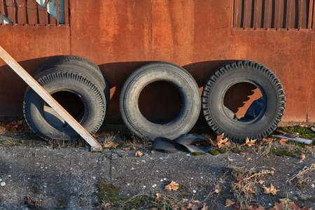 Old truck tyres stored in a junkyardの写真素材