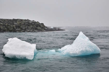 Iceberg melting at seaの写真素材