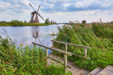 Windmill beside a canalの写真素材