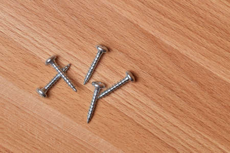 Screws on a tableの写真素材