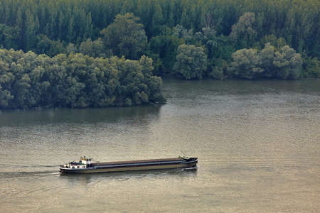 Industrial cargo ship on riverの写真素材