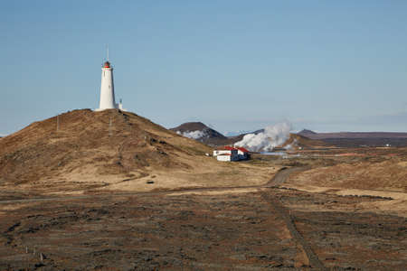 Old White Lighthouse on a hillの写真素材