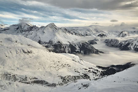 Mountain winter landscape above cloudsの写真素材