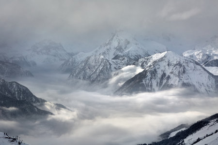 Mountain winter landscape above cloudsの写真素材