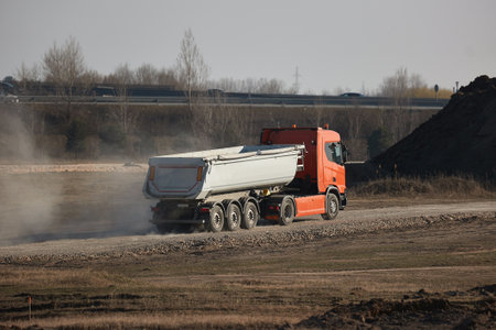 Road construction truck hauling gravelの写真素材