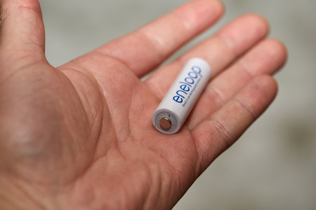 1.5 Volt AA Battery in handのeditorial素材