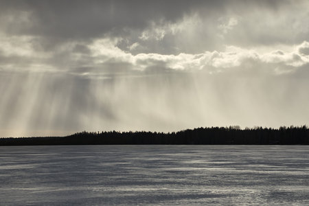 Lakeside winter rain in distanceの写真素材