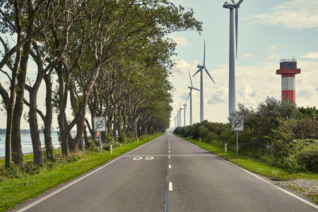 Road on a narrow waterside land in the Port of Rotterdamの写真素材