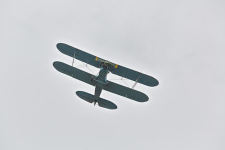 Small old airplane flyingの写真素材