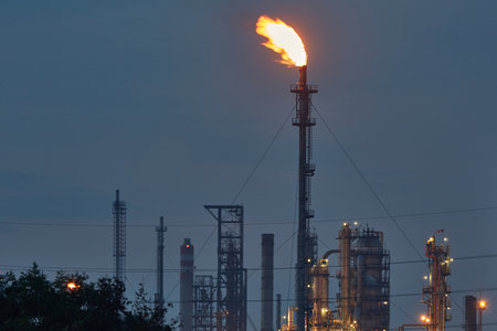 Burning refinery torch lighting gas on fireの写真素材