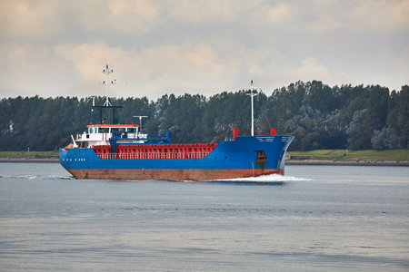 Ship carrying cargo on a riverの写真素材