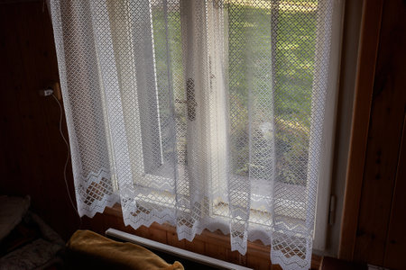 Window of a cozy old wooden houseの写真素材