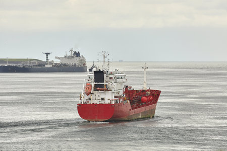 Industrial ships sailing near Rotterdamの写真素材