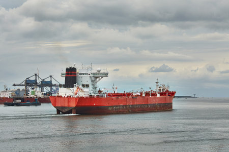 Industrial ships sailing near Rotterdamの写真素材