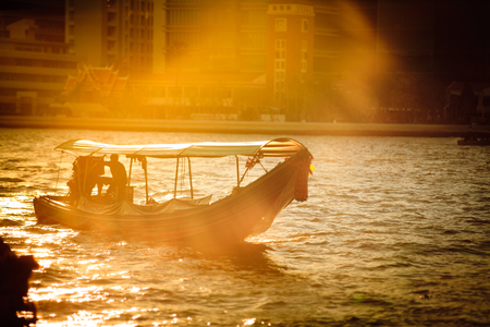 Long-tail boat Driver on  Chao phraya river,Bangkok ,Thailandの写真素材