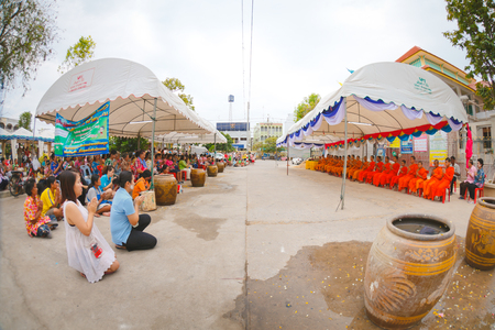 ANG THONG, THAILAND - APRIL 15,2013   Thai people sprinkle water onto a Buddha image and pour water onto monks There are the gesture of worship during the annual Songkran festival at Wat Nangnai Thammikaram on April 19, 2013 in Ang thong,Thailand のeditorial素材