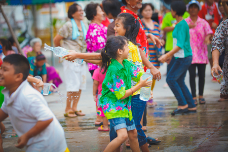 ANG THONG, THAILAND - APRIL 15,2013   Thai people and traveler came to Wat Nangnai Thammikaram for celebrating Thai s traditional new year called  Songkran Festival  by singing, dancing and  throwing water each other on April 15, 2013 in Ang thong,Thailanのeditorial素材