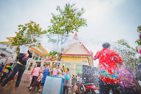 ANG THONG, THAILAND - APRIL 15,2013   Thai people and traveler came to Wat Nangnai Thammikaram for celebrating Thai s traditional new year called  Songkran Festival  by singing, dancing and  throwing water each other on April 15, 2013 in Ang thong,Thailanのeditorial素材