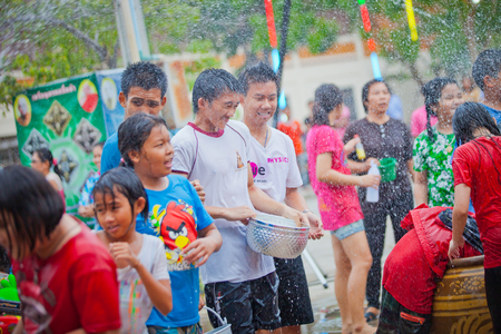 ANG THONG, THAILAND - APRIL 15,2013   Thai people and traveler came to Wat Nangnai Thammikaram for celebrating Thai s traditional new year called  Songkran Festival  by singing, dancing and  throwing water each other on April 15, 2013 in Ang thong,Thailanのeditorial素材