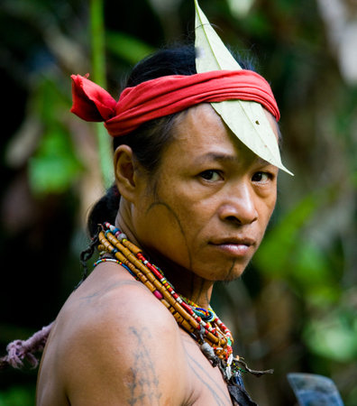 MENTAWAI PEOPLE, WEST SUMATRA, SIBERUT ISLAND, INDONESIA - 16 NOVEMBER 2010: Portrait of a man Mentawai tribe. Close-up.のeditorial素材