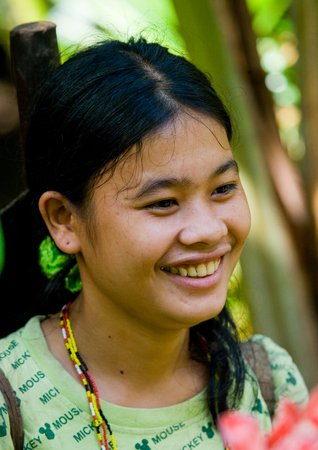 MENTAWAI PEOPLE, WEST SUMATRA, SIBERUT ISLAND, INDONESIA - 16 NOVEMBER 2010: Portrait of a young girl Mentawai tribe.のeditorial素材