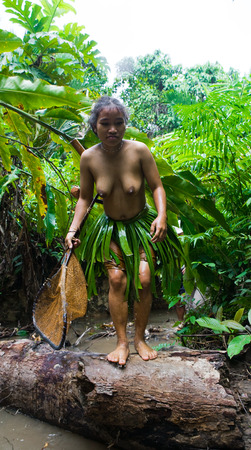 MENTAWAI PEOPLE, WEST SUMATRA, SIBERUT ISLAND, INDONESIA - 16 NOVEMBER 2010: Women Mentawai tribe fishing.のeditorial素材