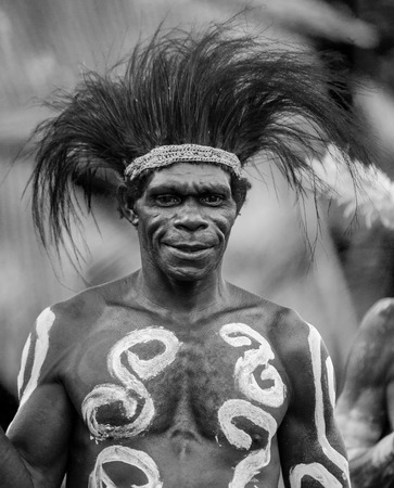 INDONESIA, IRIAN JAYA, ASMAT PROVINCE, JOW VILLAGE - JUNE 12: Portrait of a Warrior Asmat tribe in traditional headdress.のeditorial素材