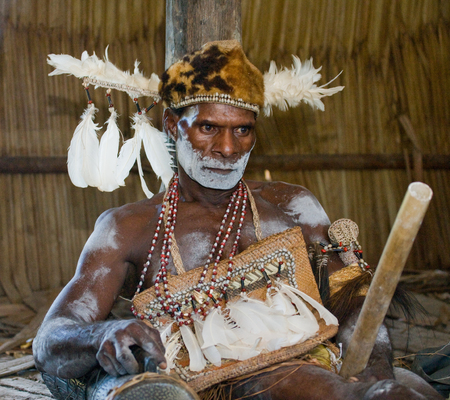 INDONESIA, IRIAN JAYA, ASMAT PROVINCE, JOW VILLAGE - JUNE 12: Portrait of a Warrior Asmat tribe in traditional headdress.のeditorial素材