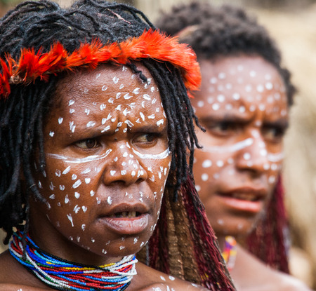 DANI VILLAGE, WAMENA, IRIAN JAYA, NEW GUINEA, INDONESIA - 15 MAY 2012: Portrait of Woman Dani tribe in ritual coloring on the body and face.のeditorial素材