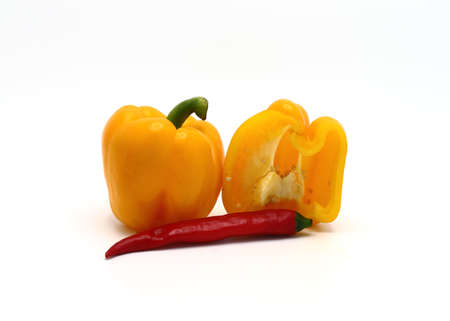 Composition of yellow and red sweet peppers of different sizes on a light background. Natural product. Natural color. Close-up.の写真素材