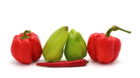 Four sweet ripe red and green peppers on a light background. Natural product. Natural color. Close-up.の写真素材