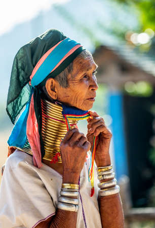 Portrait of an old Padaung woman in traditional dress and with metal rings around her neck. February 12, 2019, Myanmar.のeditorial素材