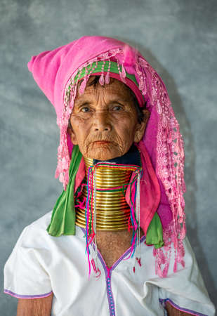 Portrait of an old Padaung woman in traditional dress and with metal rings around her neck. February 12, 2019, Myanmar.のeditorial素材