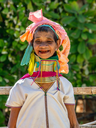Portrait of an old Padaung woman in traditional dress and with metal rings around her neck. February...