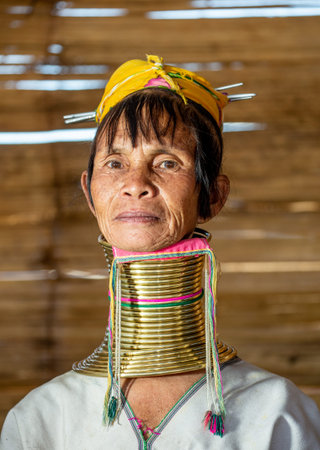 Portrait of an old Padaung woman in traditional dress and with metal rings around her neck. February...