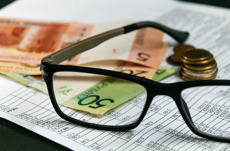 Notice of payment for housing and communal services. Glasses and Belarusian money. The concept of...