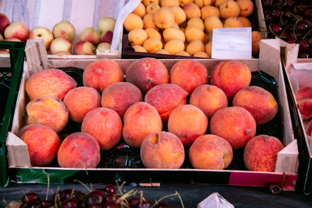 Ripe fresh peaches. Sale of peaches at the farmers' market. beautiful peaches.