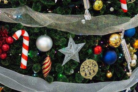 Many different toys on the tree close-up. Christmas and New Year.