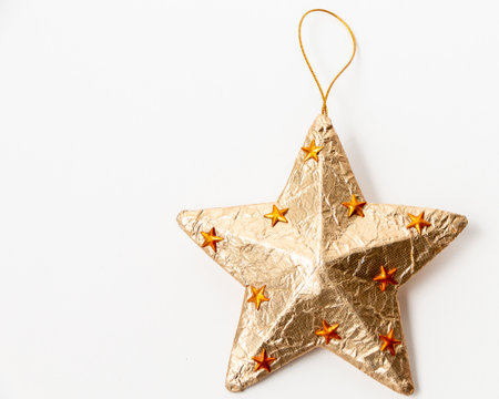 Gold Christmas star on a white background. close-up. Christmas and New Year. Christmas mood.の写真素材