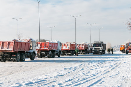 Trucks take out the snow after a blizzard. Cleaning the city from the consequences of a snow storm.の写真素材