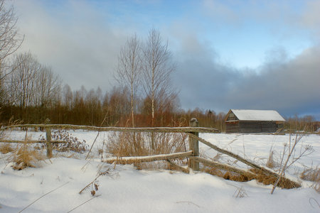 village house behind an old fenceの写真素材