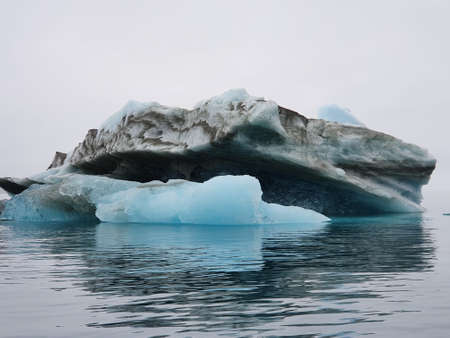 Iceberg with dirt inclusions in Godthaabsfjord, Greenlandの写真素材