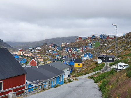 View from one of the many hills of Qaqortog, Iceland, towards the colorful houses of the city