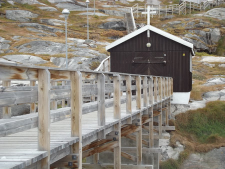 Wooden footbridge with a small chapel in Ilulissat, Greenlandの写真素材