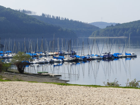 Sandy beach and small boat harbor of the Biggetalsperre (Bigge lake), Sauerland, North Rhine-Westphalia, Germanyのeditorial素材