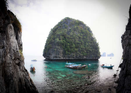 Long Tail moored on a Wild Beach of Ko Phi Phi Leyの写真素材