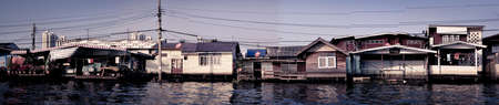 Old Houses along the river in Bangkokの写真素材