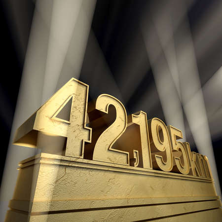 The marathon distance in golden letters on a golden pedestalの写真素材