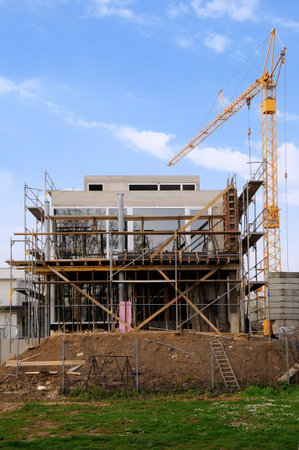 Construction site with crane under a blue sky