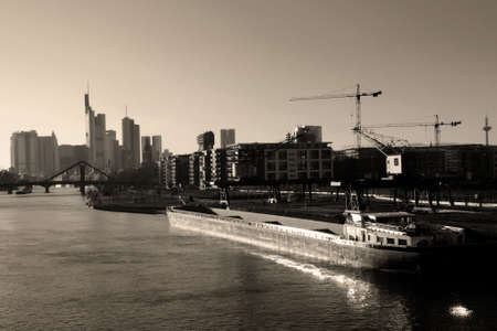 An inland port of Frankfort in Germany with the bank skyline behindの写真素材